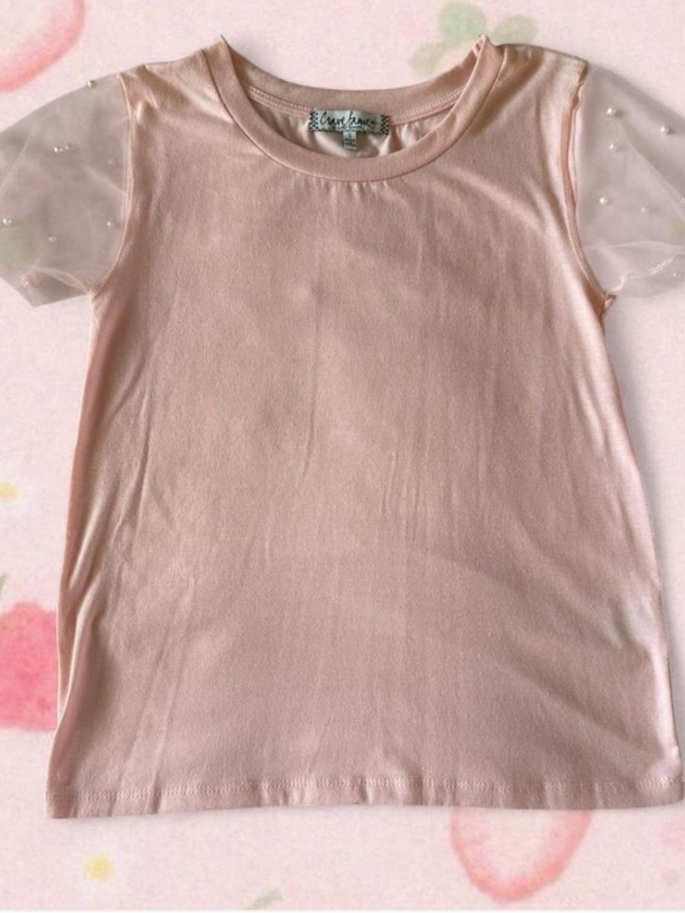 Pink shirt with pearly mesh sleeves